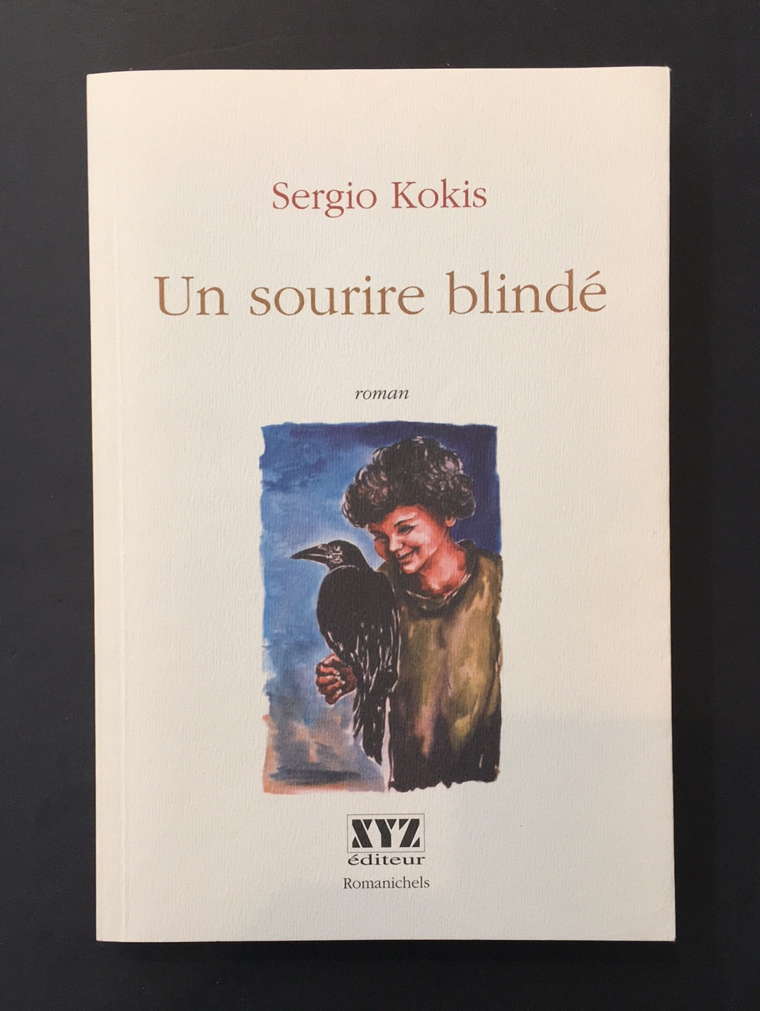 UN SOURIRE BLINDÉ